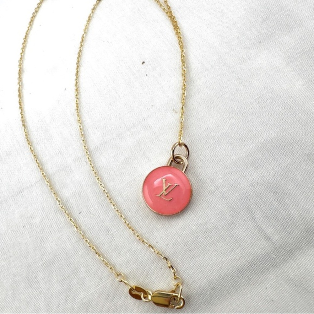 Repurposed necklace with Louis Vuitton round pink zipper pull.